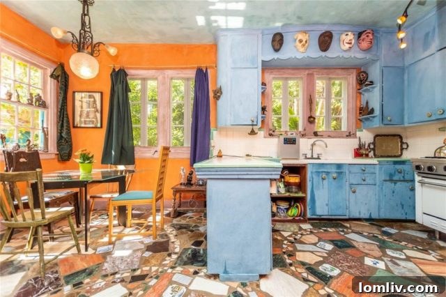 Another view of the kitchen, demonstrating how art seamlessly (or daringly) integrates into daily life.