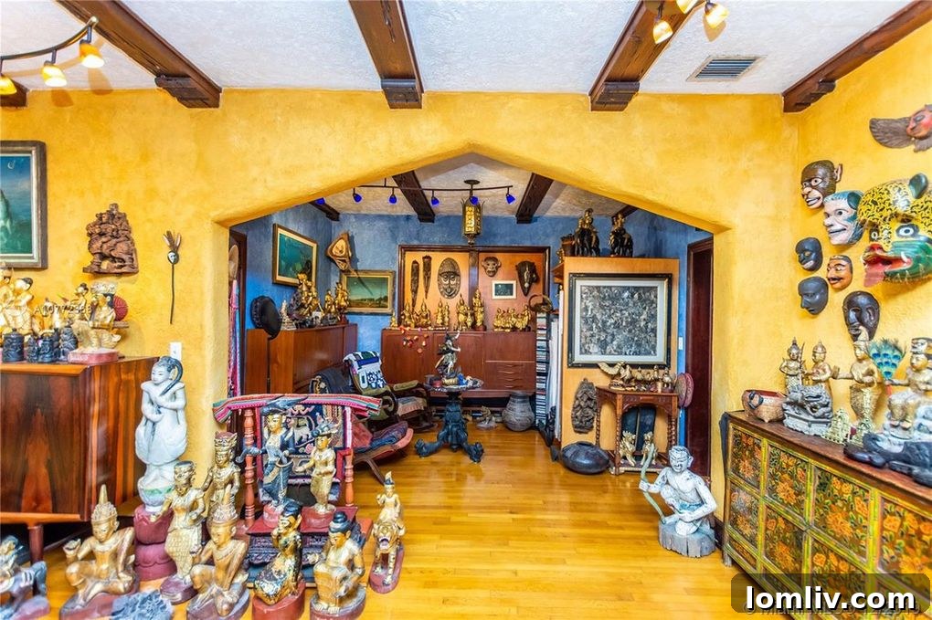 A wide shot of an art-filled room, highlighting the density of statues and decor.