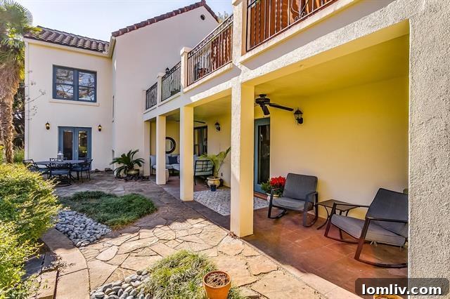 Charming second-floor bedroom with access to a private front-facing terrace, filled with natural light