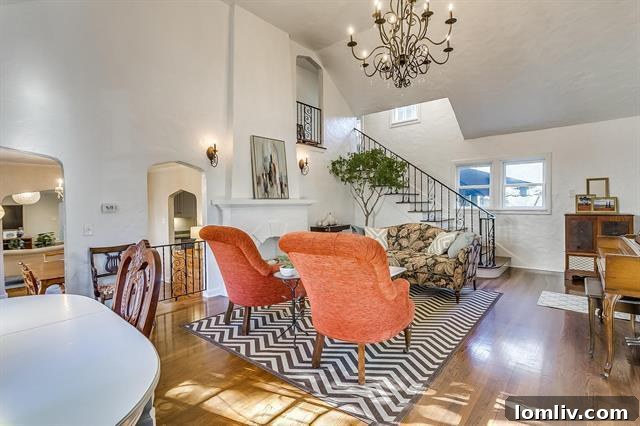 Double-height living room with a sweeping staircase and elegant decor in Fort Worth home