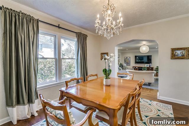 Elegant dining room connected to the living room by a few steps, ready for entertaining