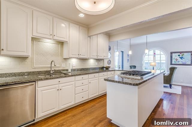 Modern, renovated kitchen with Viking cooktop, integrated appliances, and a central island