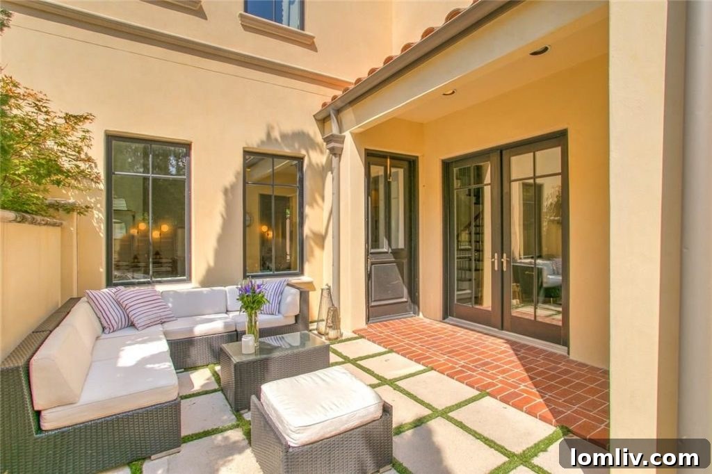 The inviting entry courtyard of 2712 Calder Court in Fort Worth offers a private and tranquil space.