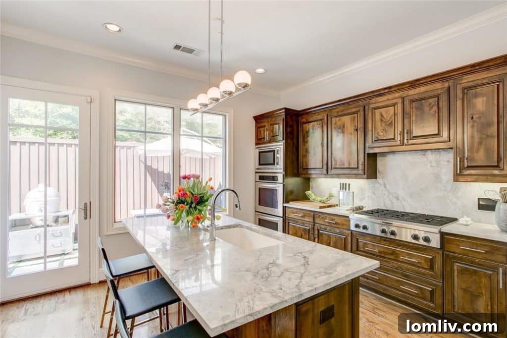 The bright and open kitchen with an adjacent patio at 2712 Calder Court, located within the desirable So. 7 development.