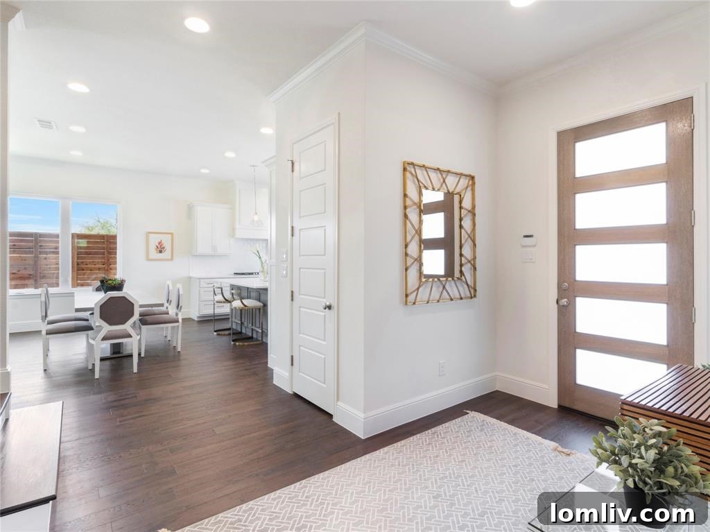 Spacious and bright open-concept living area with elegant flooring