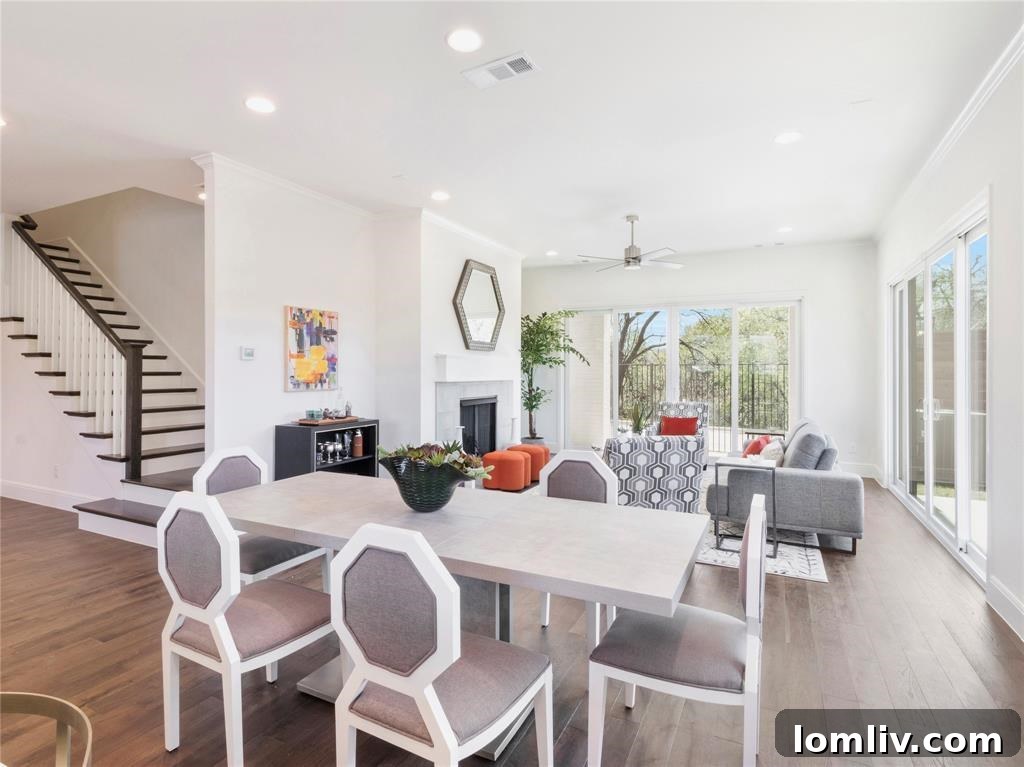 Elegant living room with a modern ceiling fan and glass doors