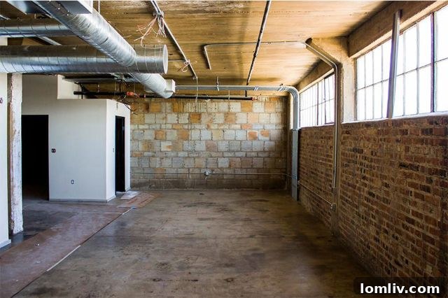 The distinctive architecture of the Supreme Golf Warehouse apartments at 201 S. Calhoun St., a vibrant example of Fort Worth's repurposed buildings, also home to a popular local bar.