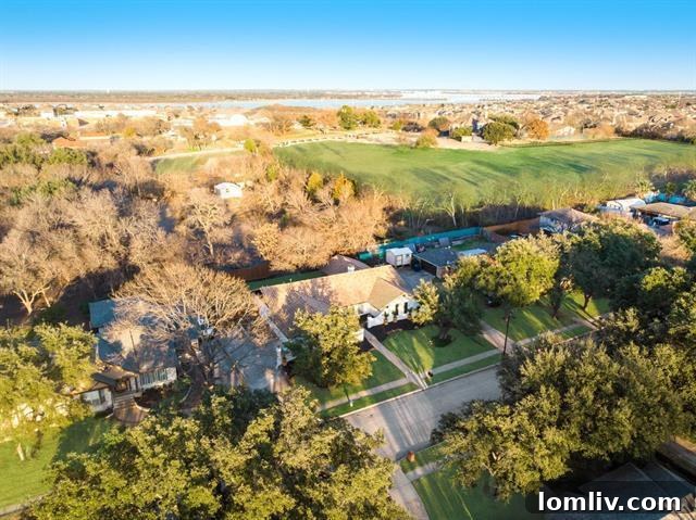 Inviting back patio and landscaped yard, perfect for outdoor entertaining at 3914 Amy Avenue.