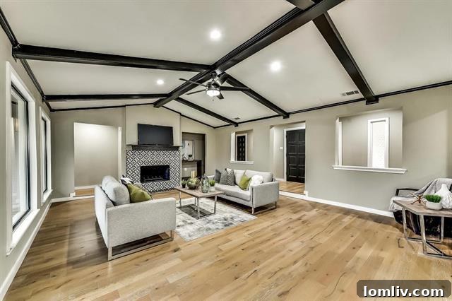 Spacious living area with new hardwood floors and designer paint at 3914 Amy Avenue.