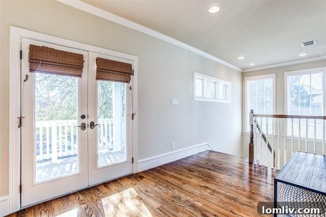 Detailed view of the landscaped front yard and entrance of the Craftsman home