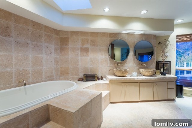 Spacious master bathroom in Unit 2B, featuring abundant closet space and a clear view of the private master bedroom patio