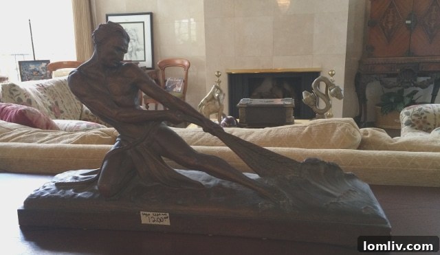 Exquisite bronze sculpture depicting figures engaged in the arduous task of pulling a fishing net from the sea