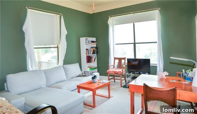 One of the versatile additional bedrooms, currently used as a cozy sitting or TV room