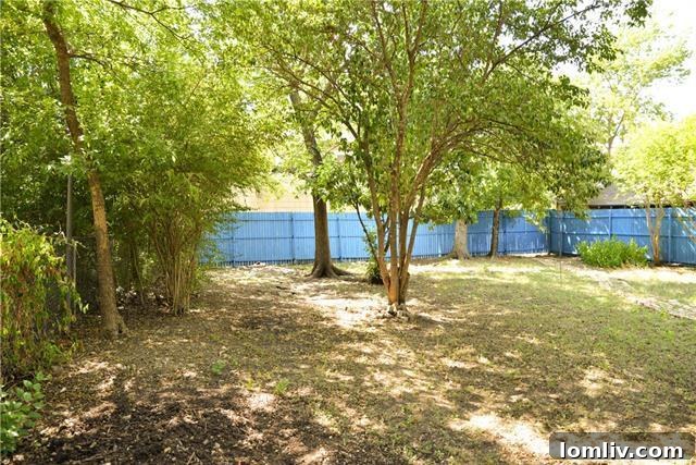 Spacious backyard of the Fairmount cottage, offering ample potential for outdoor living