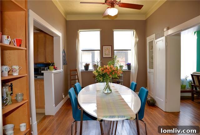 View through the enfilade, showing the dining area with built-in china cabinets