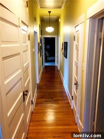 Close-up of the gas range and industrial red hood in the Fairmount cottage kitchen