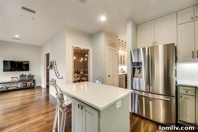 Spacious living room with hardwood floors in Highland Park residence