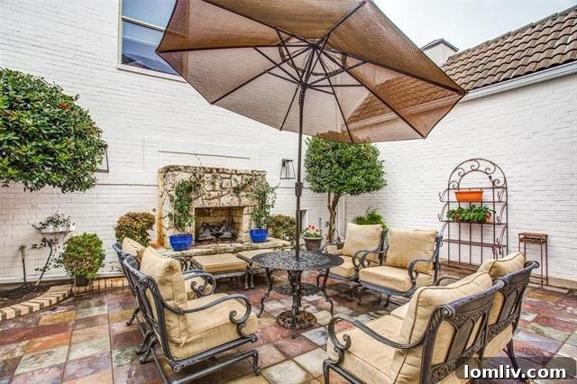 Private Courtyard with Colorful Slate Hardscape and Gas Fireplace