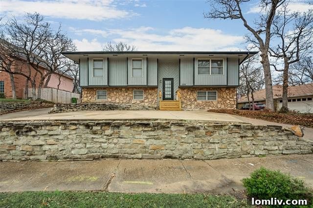 Charming exterior of the remodeled basement home in Bedford