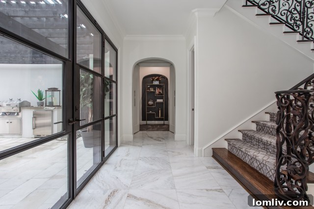 Elegant Steel Doors connecting interior to outdoor kitchen at 4000 Monticello Drive