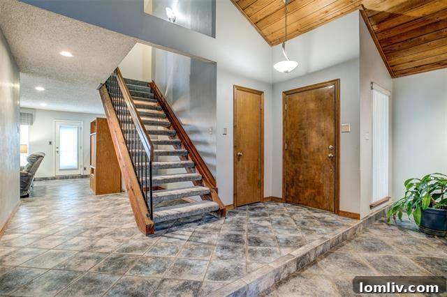 Living room with floating staircase and cedar ceilings