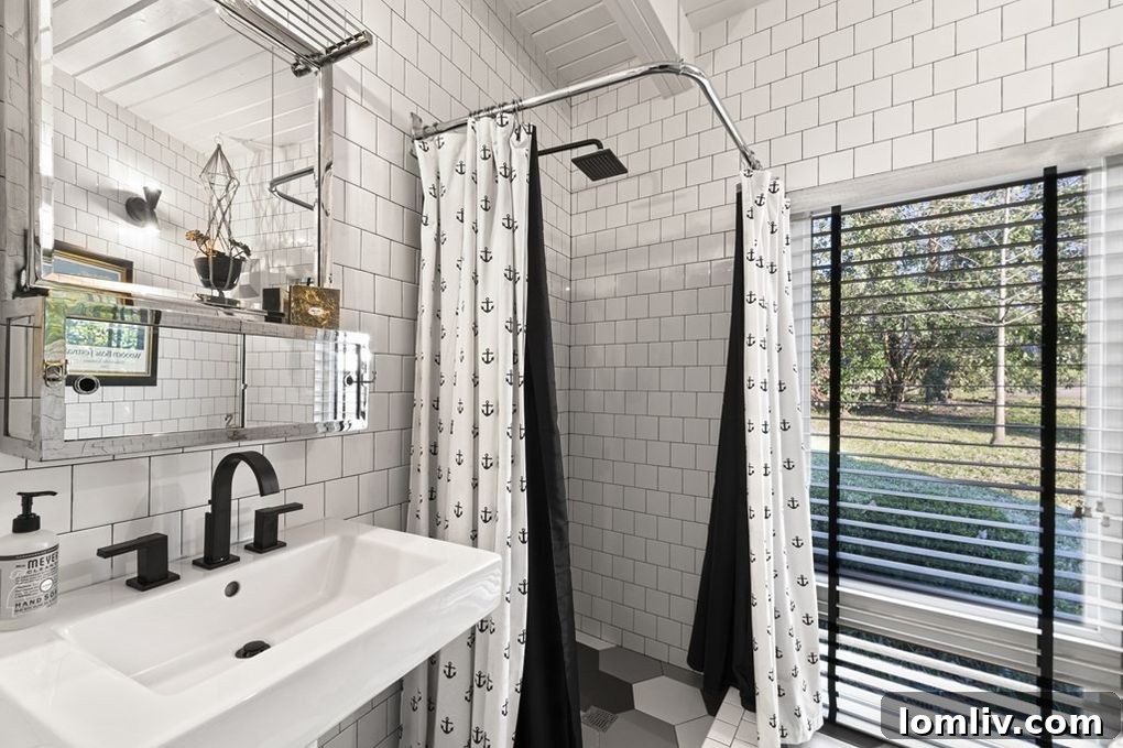 Stylish bedroom with large windows overlooking Cedar Creek Lake