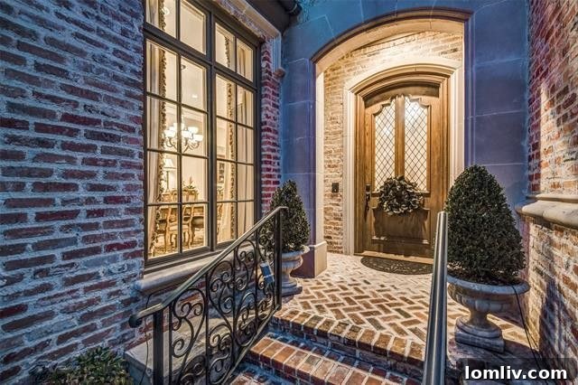 Elegant living room with large windows overlooking a lush greenbelt in a luxury Far North Dallas home.
