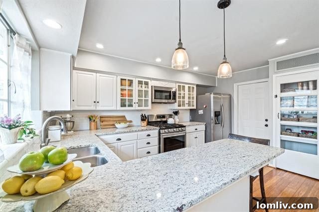 Kitchen with granite countertops and gas stove at 402 Nottingham Drive