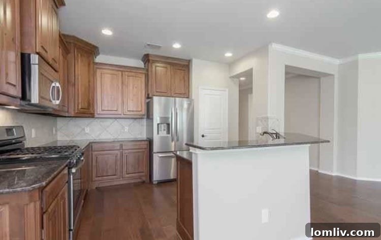 A modern kitchen and dining area inside the home at 6717 Festival Lane
