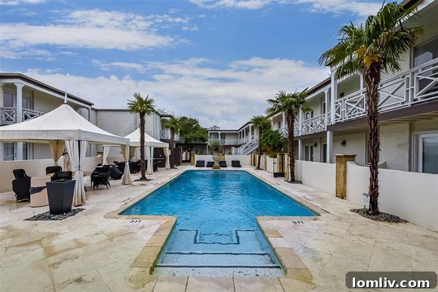 The pristine community swimming pool and courtyard at Bella Gardens Condominiums