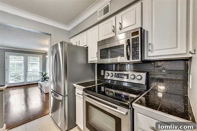 The breakfast bar and open kitchen layout of Unit 222