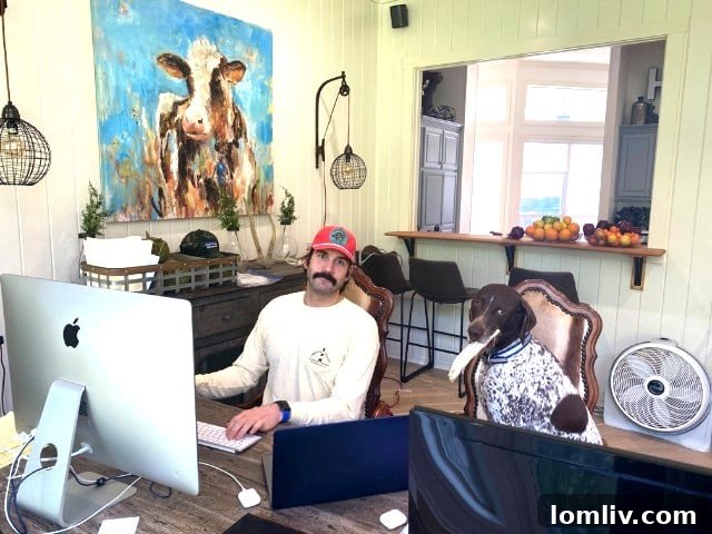 Rogers Healy working from home with his dog, showcasing the positive impact pets can have on the remote work experience.