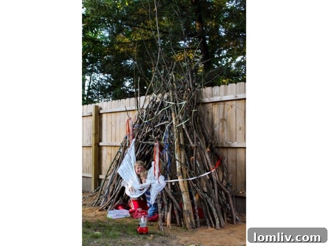 Backyard Builds for Endless Kid Fun 10 Repurposed backyard play fort with hunter's netting