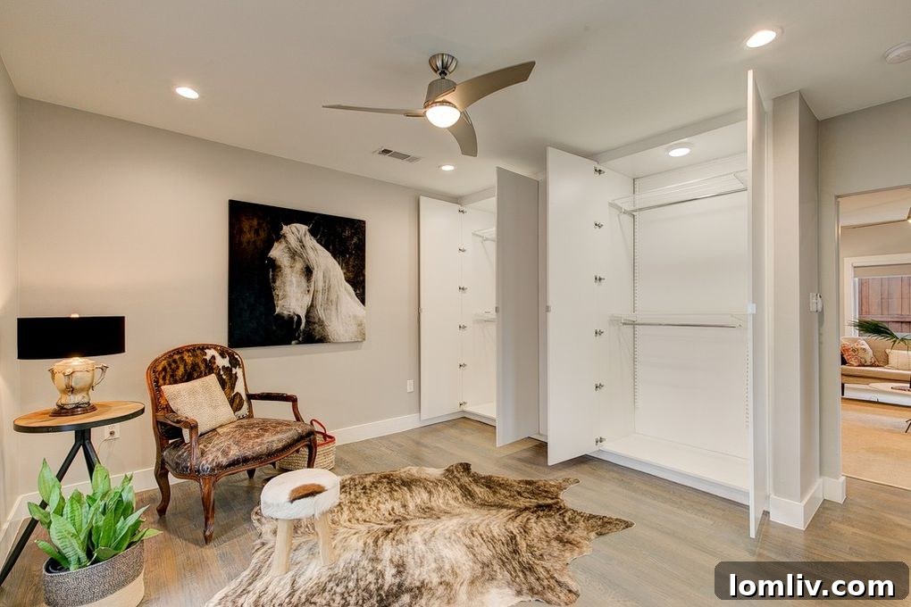 Second bedroom with front porch access and modern closet systems