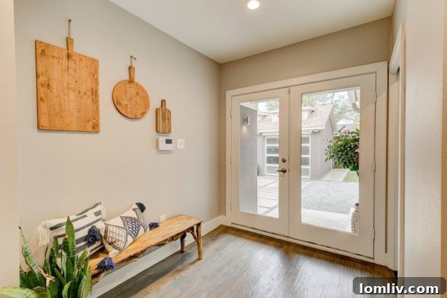 Utility area with half bath and laundry, leading to the backyard