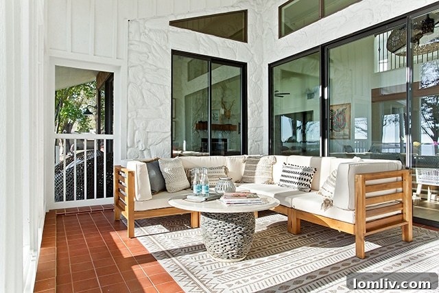 Sliding glass doors open up to a screened-in porch with views of the lake.
