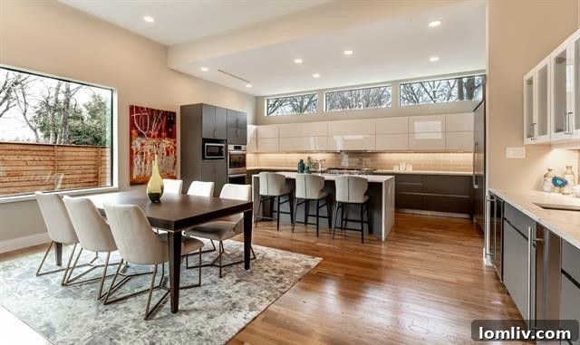 Modern kitchen with large windows overlooking lush greenery, ensuring privacy