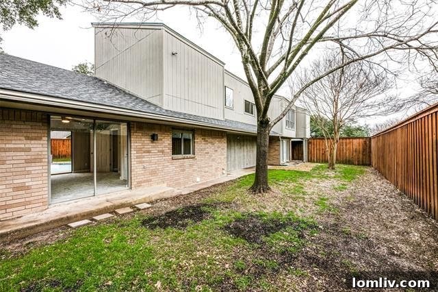 Spacious and serene master bedroom with a cozy fireplace, perfect for relaxation.