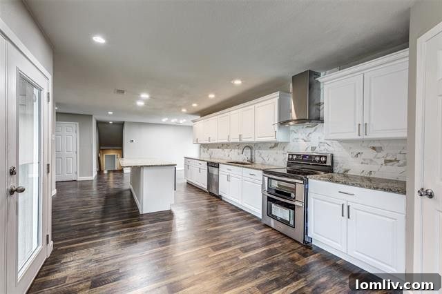 Spacious living room featuring expansive windows overlooking the property.