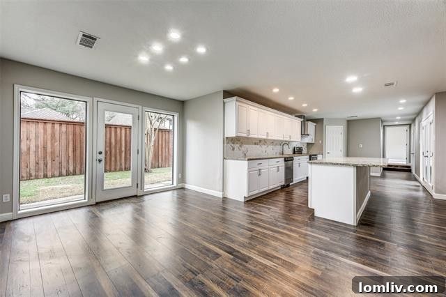 Another perspective of the open concept living space, highlighting its elegant design.