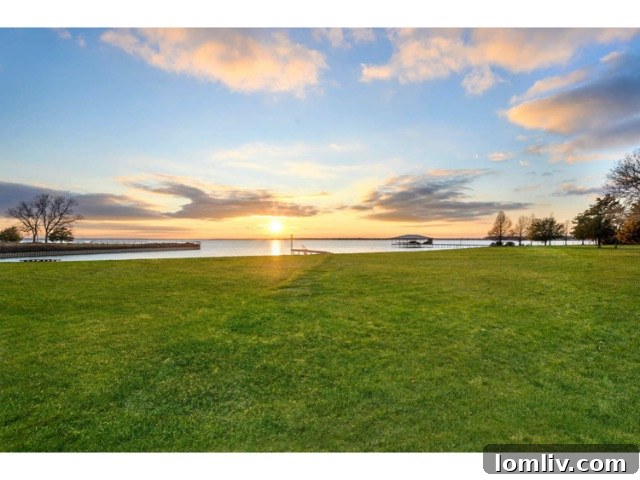 Panoramic view of the serene lake and private dock from the luxury lake house estate