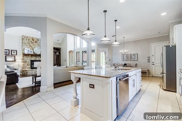 Versatile media room with wall sconces and wide-open space for family activities