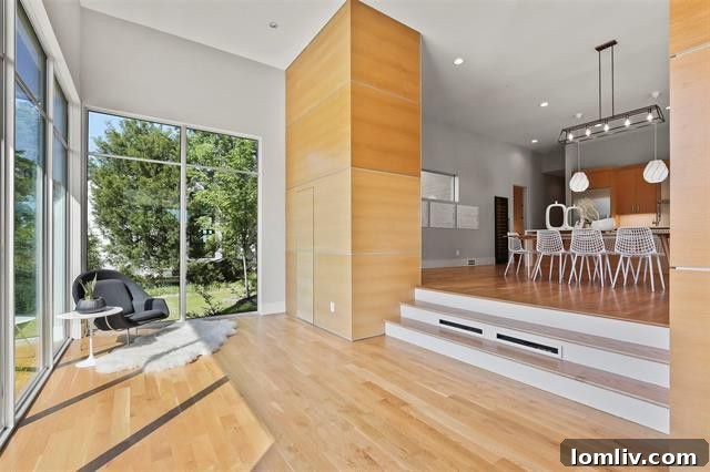 Grand Entrance with Staircase Leading to Open Concept Living Area