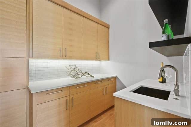 Living Room with Chevron Marble Fireplace and Backyard Views