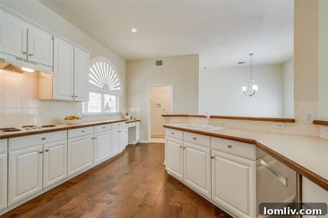 Spacious kitchen with ample counter space and a butler's pantry in a traditional Dallas home