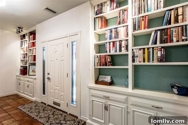 Elegant Spanish-style exterior of a luxury Far North Dallas home with mature landscaping