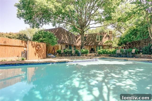 Luxurious master bathroom featuring a classic clawfoot tub and elegant tile work