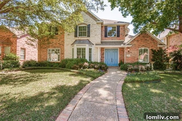 Classic traditional home exterior with lush landscaping and elegant curb appeal in Far North Dallas