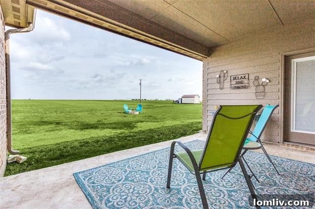 Expansive private backyard with lush green grass, perfect for outdoor activities