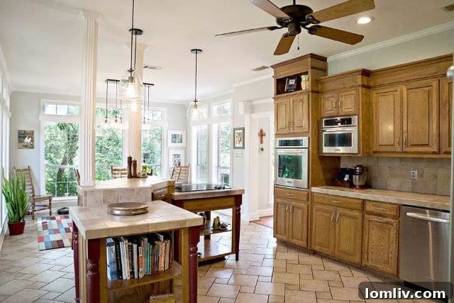 Elegant kitchen interior with a center island, custom cabinetry, and stainless steel appliances.